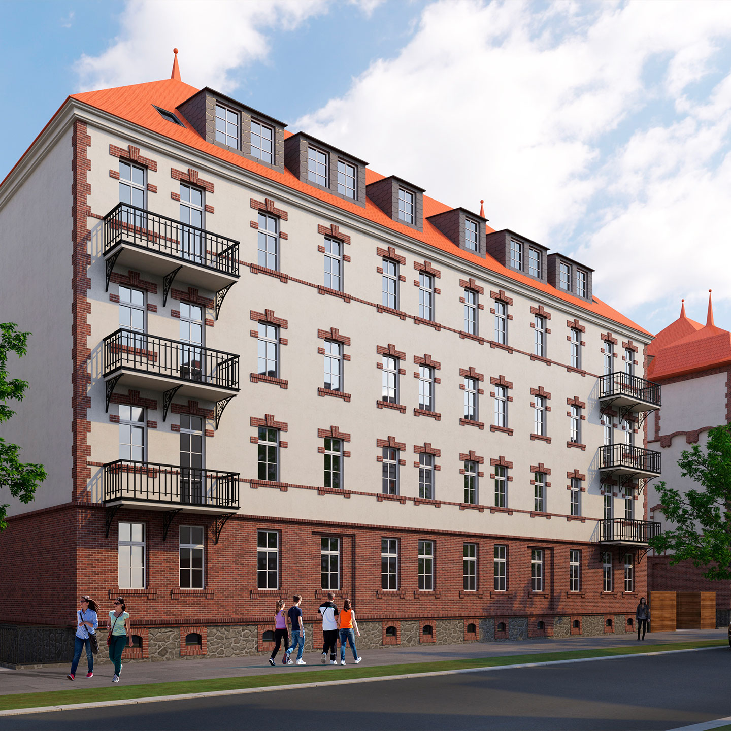 Mehrgeschossiger Altbau mit rotem Ziegeldach, Gauben und schmiedeeisernen Balkonen